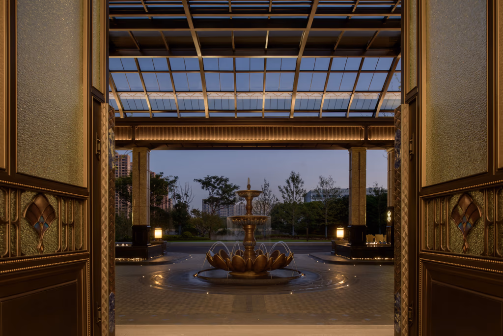 The Jianfa Haiyue entry canopy at dusk — stained glass overhead